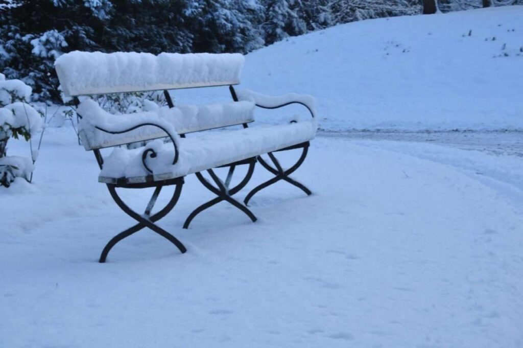 A bench covered with snow during the winter season in Illinois