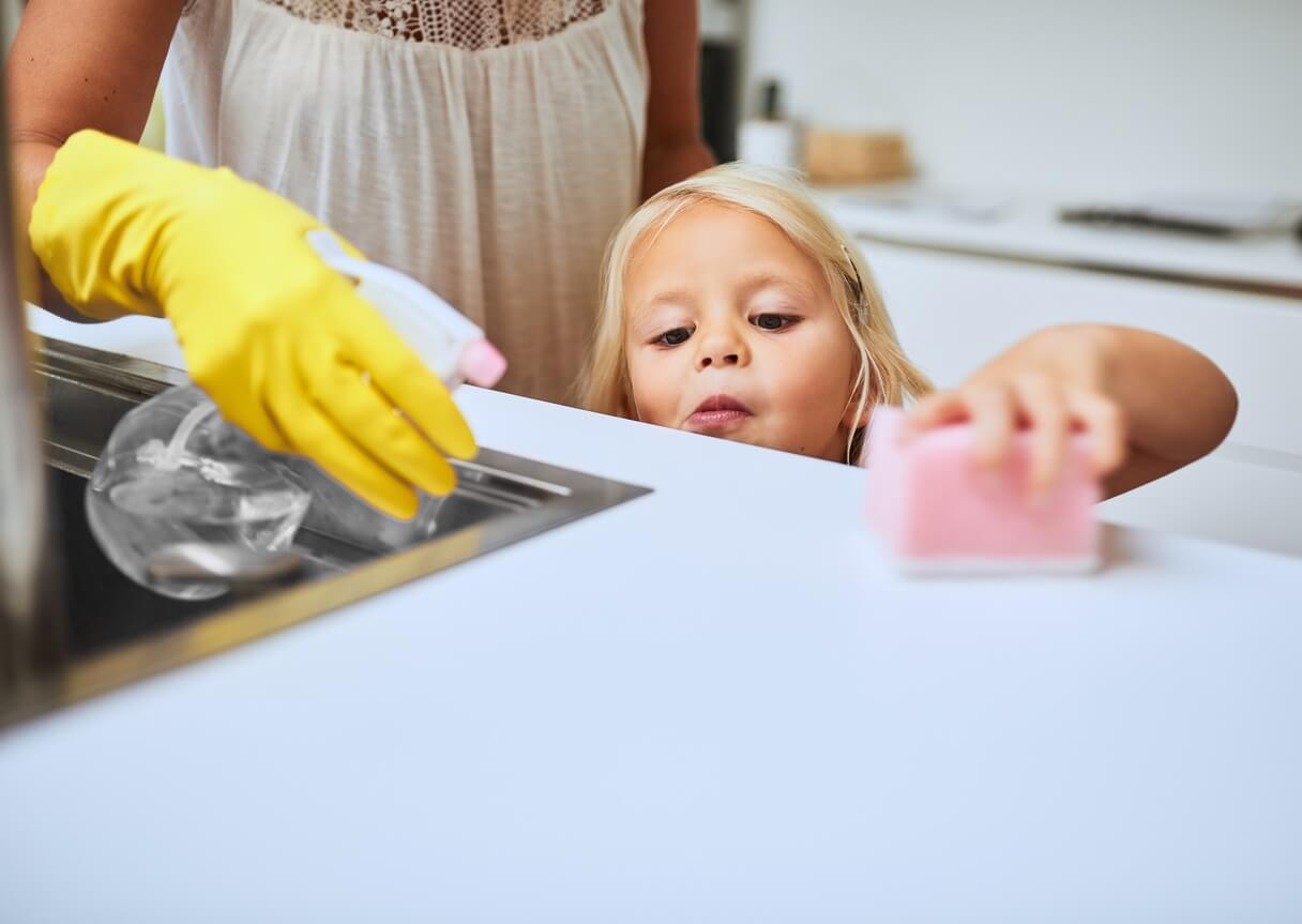 A young girl practicing kitchen pantry cleaning in Indiana