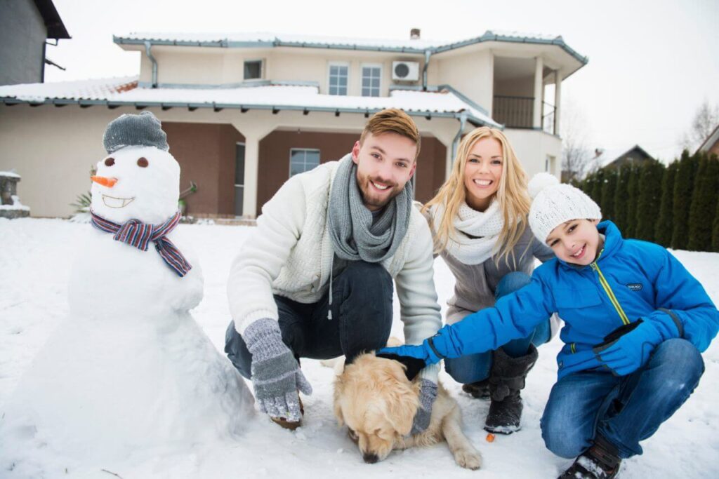 A family in front of a house is satisfied after pest service in Indiana