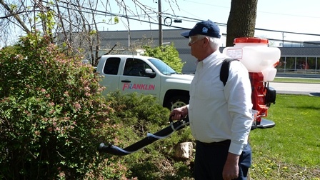 A man provides mosquito pest control services in the Chicago and Rockford areas.